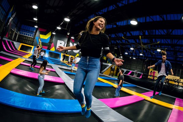 Photo of woman smiling and jumping in Free-Jump