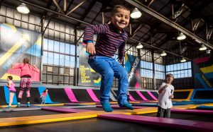 Boy jumping in a KinderGym class