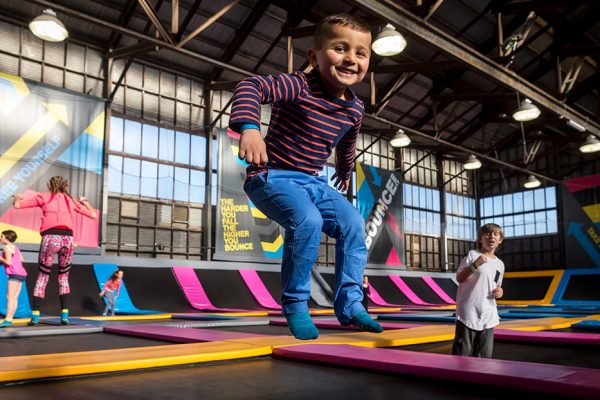 Boy jumping in a KinderGym class