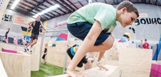 Photo of boy doing parkour in X-Park